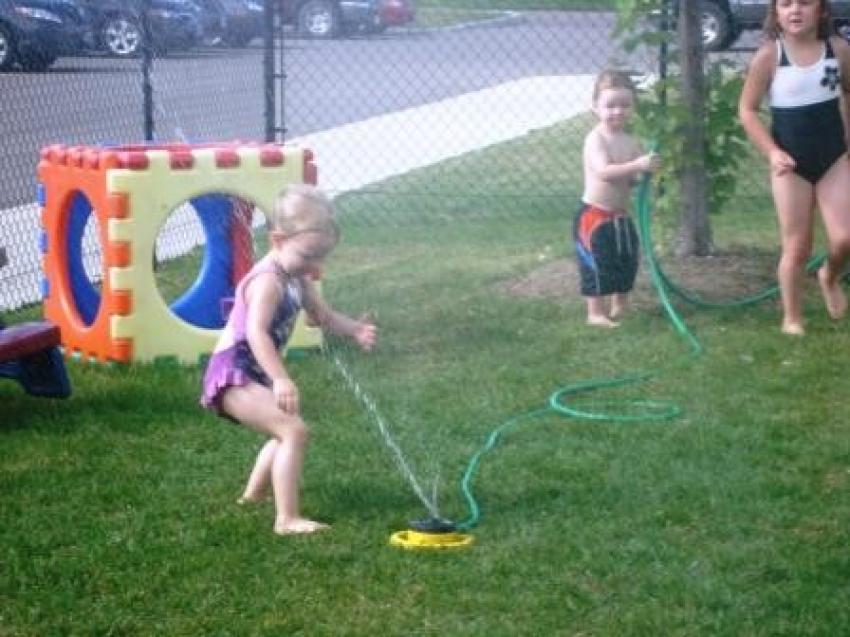 Summer sprinkler play